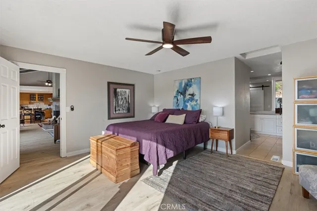 a spacious bathroom with a double vanity sink a mirror and a bathtub