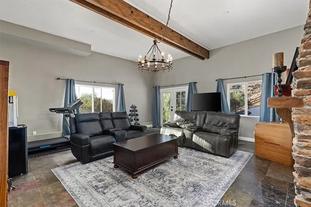 a view of a chair and tables in the balcony