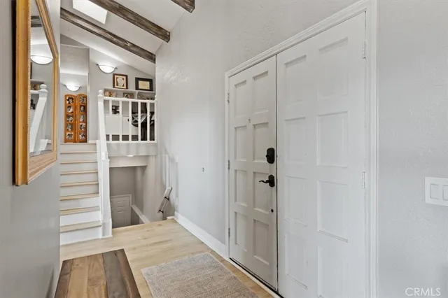 a kitchen with sink a stove and chairs