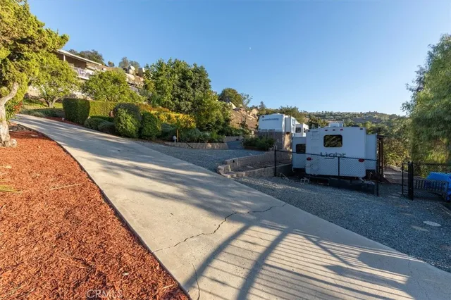 a view of a road with a building in the background
