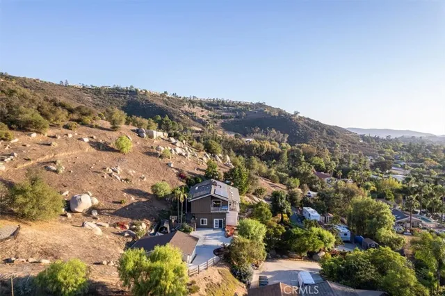 a view of a street with trees on both side of the road