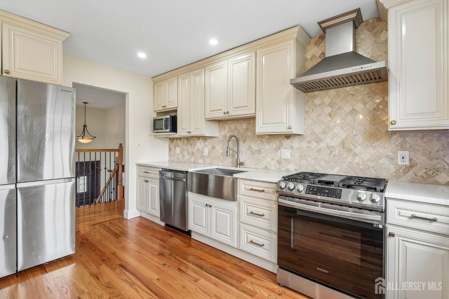 2 Marc Court Edison, NJ 08820 - Photo 12 of 23 a kitchen with a stove a sink and a refrigerator