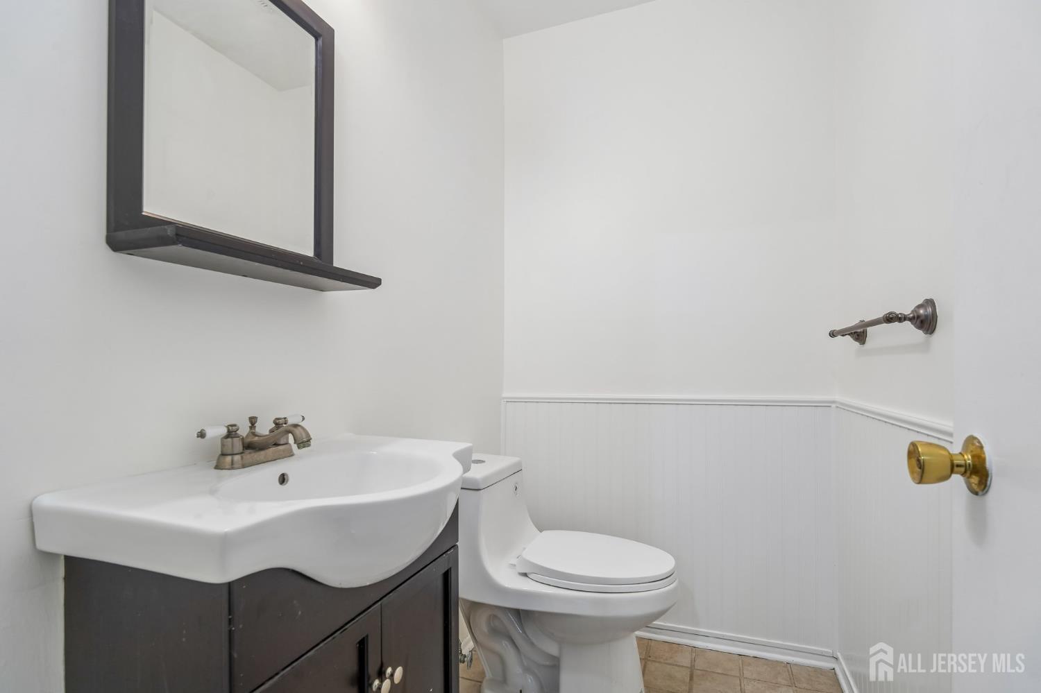 2 Marc Court Edison, NJ 08820 - Photo 17 of 23 a bathroom with a sink a toilet and mirror