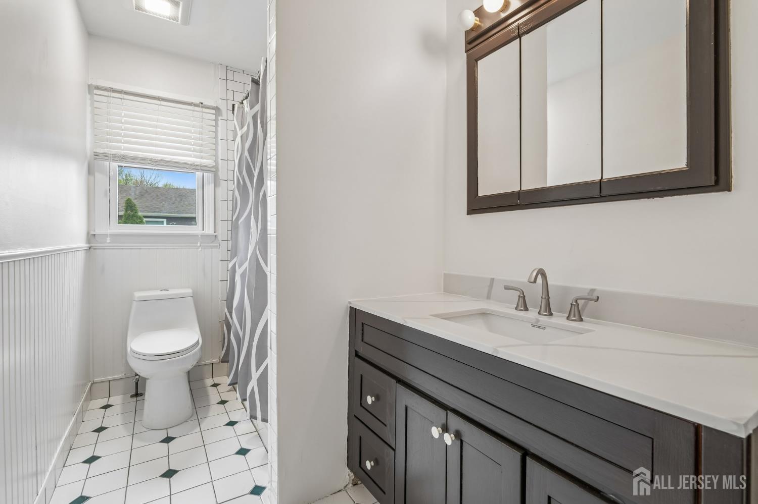 2 Marc Court Edison, NJ 08820 - Photo 18 of 23 a bathroom with a granite countertop sink toilet and mirror