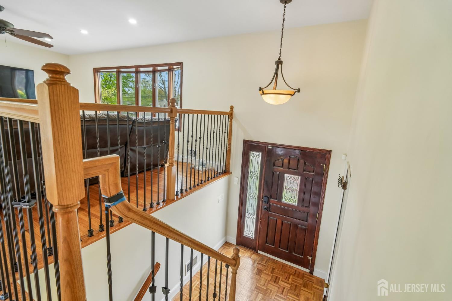 2 Marc Court Edison, NJ 08820 - Photo 2 of 23 a view of a hallway with wooden floor and stairs