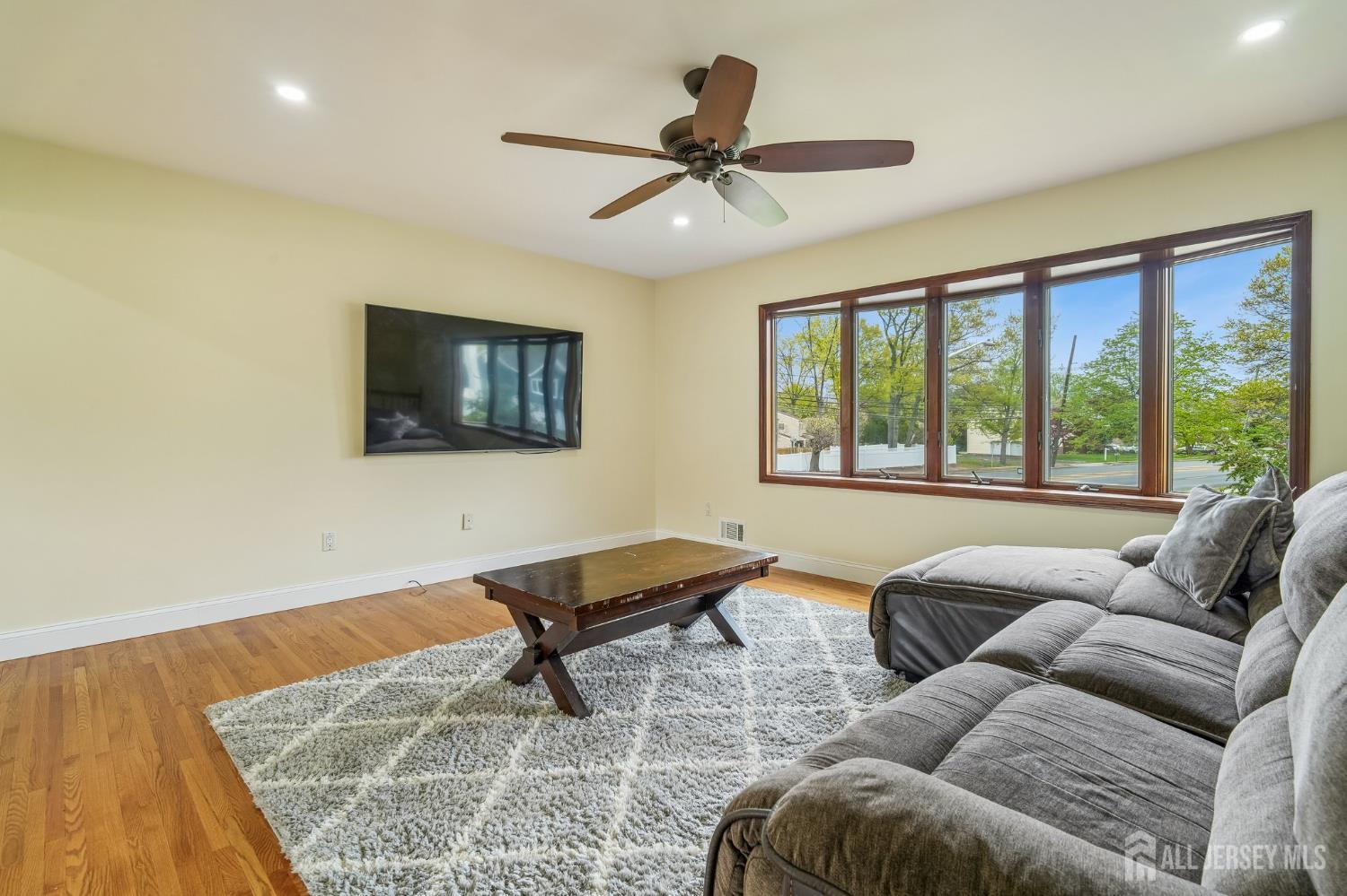2 Marc Court Edison, NJ 08820 - Photo 4 of 23 a living room with furniture and a flat screen tv