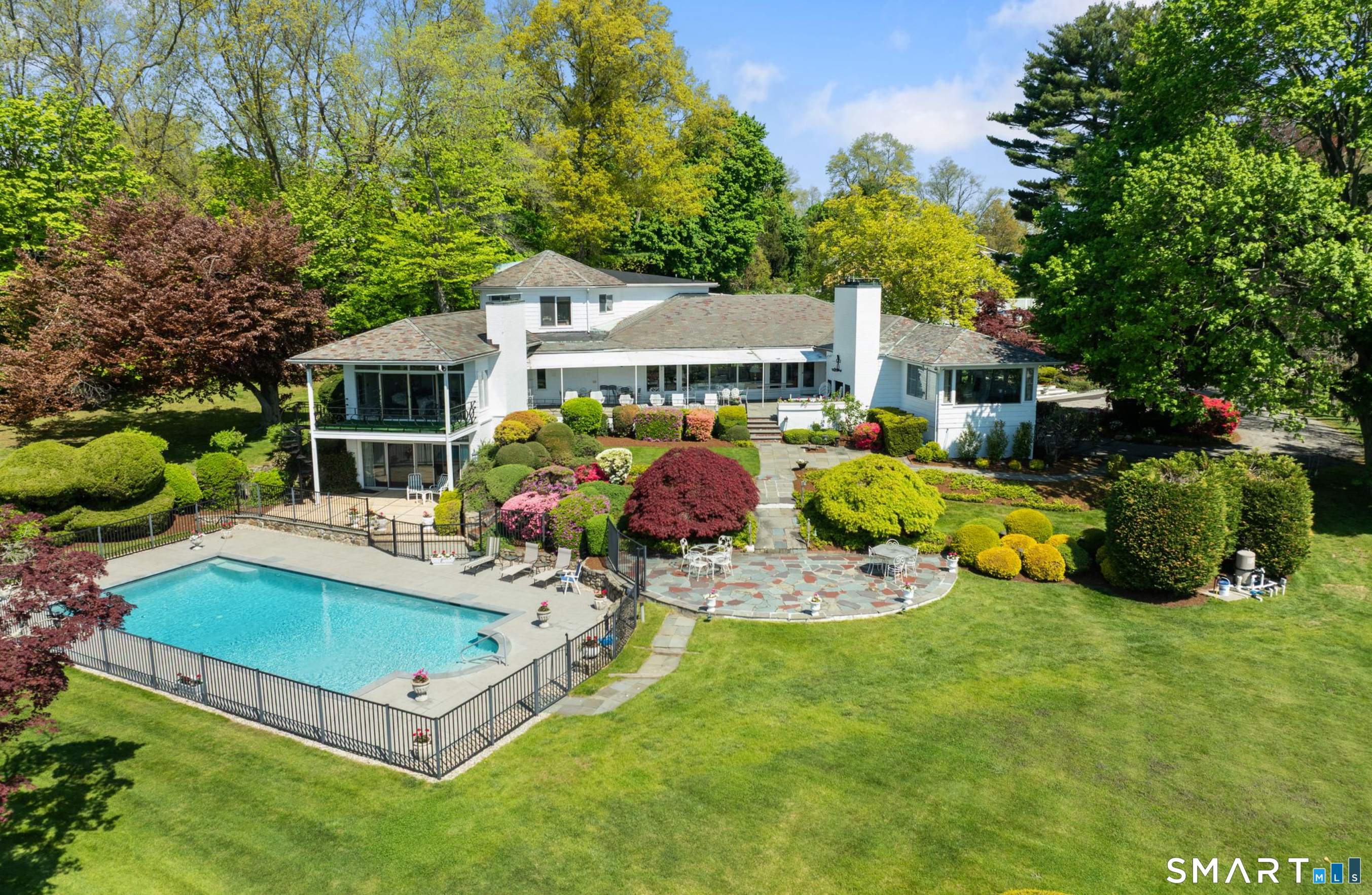 7 Sasqua Road Norwalk, CT 06855 - Photo 1 of 40 a view of a house with backyard porch and sitting area