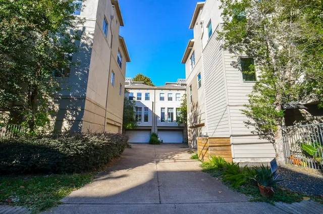 a view of house with outdoor space and trees