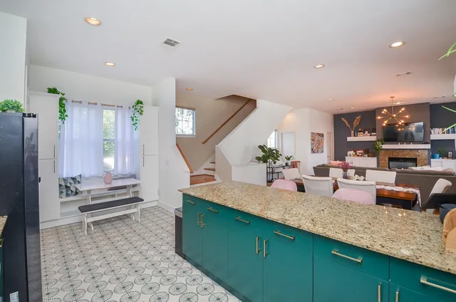 a kitchen with sink and refrigerator