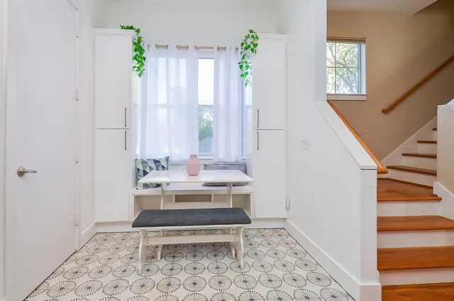 a bathroom with a sink a toilet and a window