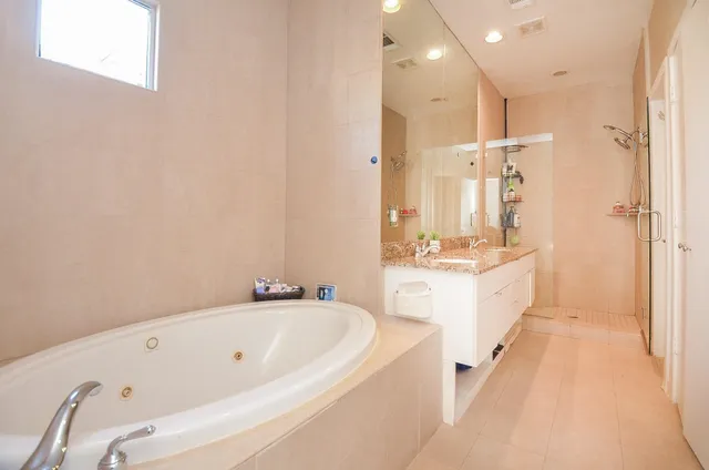a bathroom with a bathtub and a sink