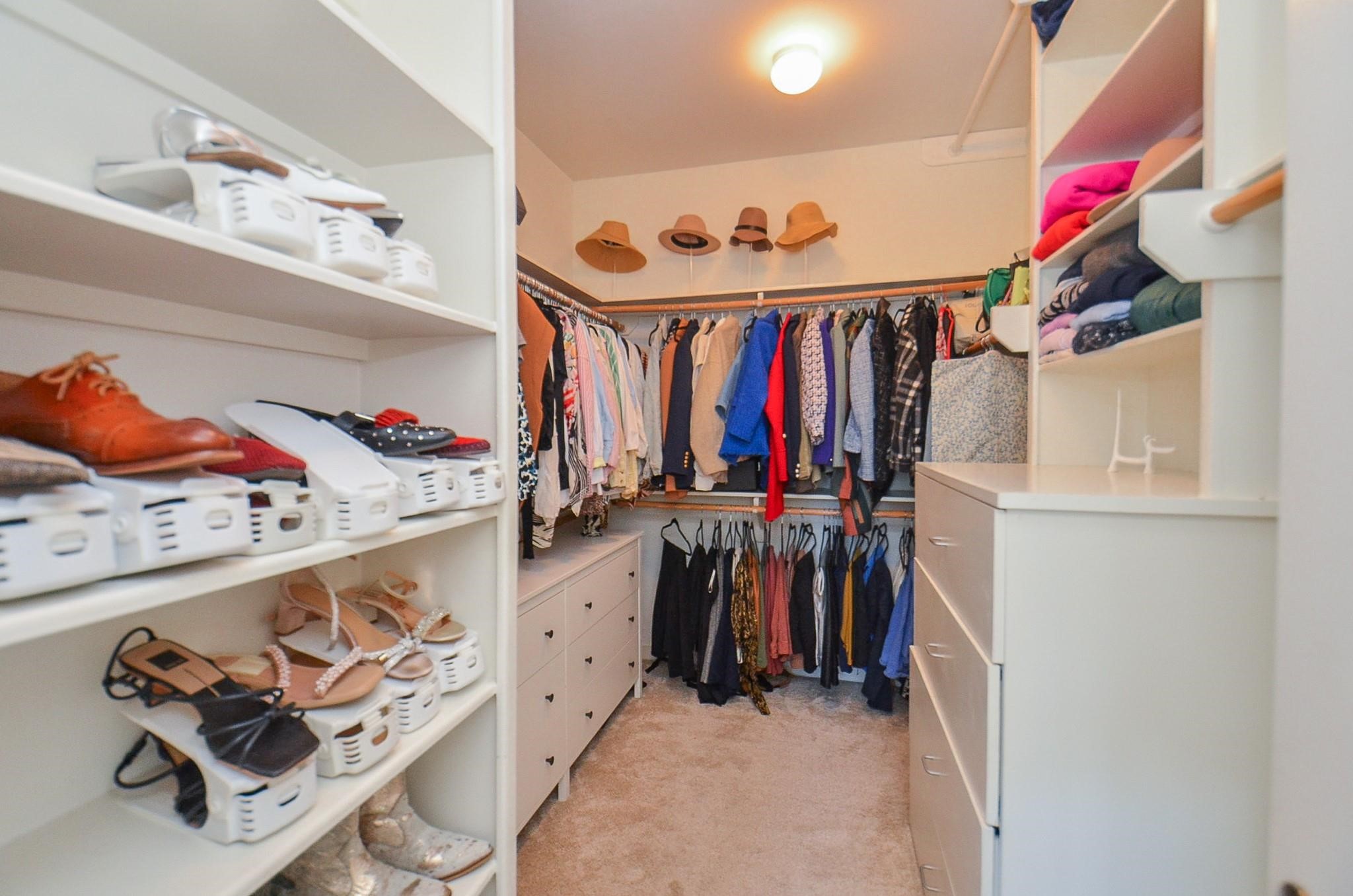 1116 Columbus Street Houston, TX 77019 - Photo 23 of 32 a view of walk in closet with clothes