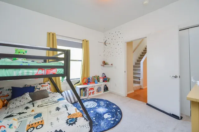 a bed room with furniture and a window