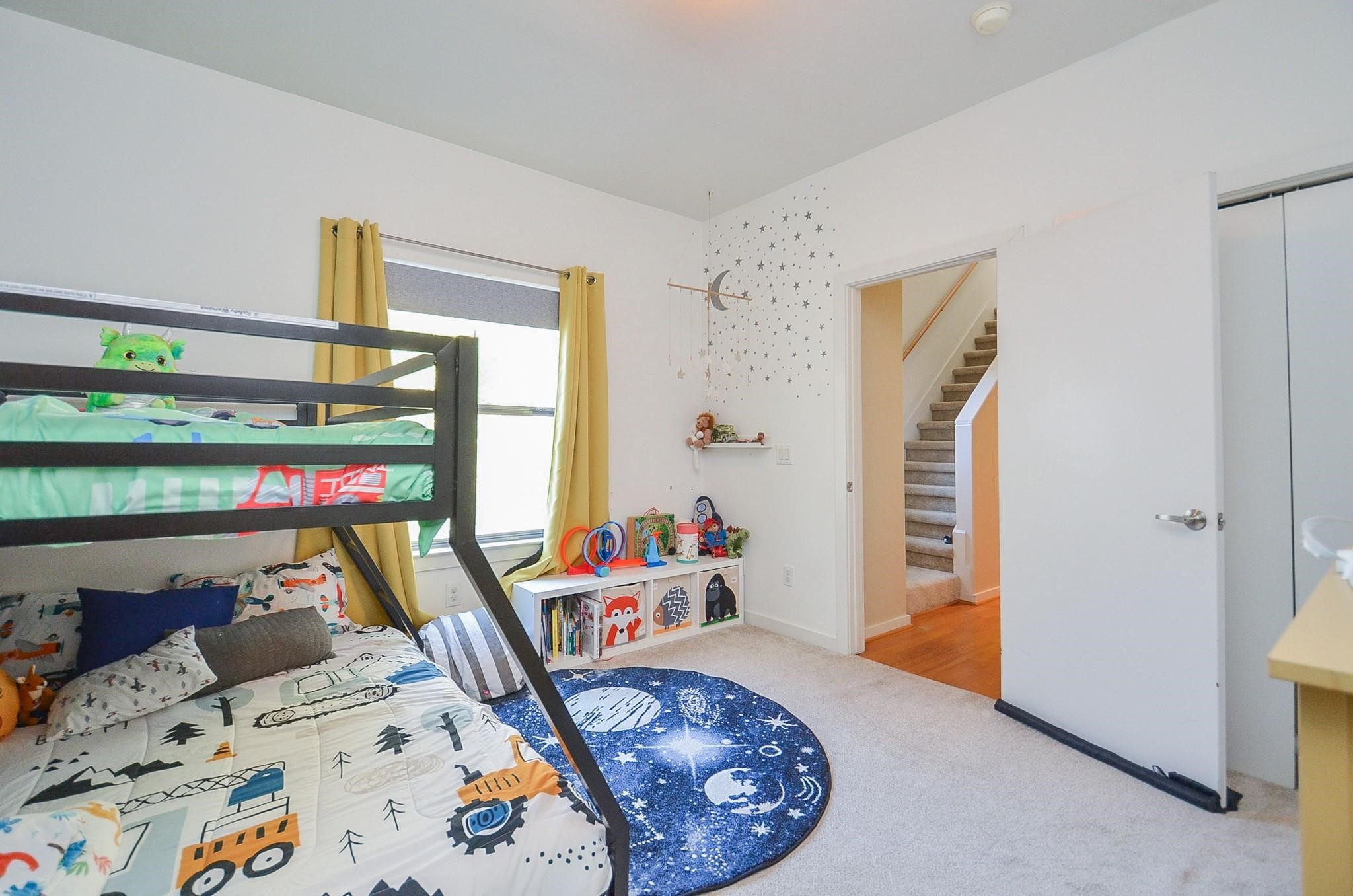 1116 Columbus Street Houston, TX 77019 - Photo 24 of 32 a bed room with furniture and a window