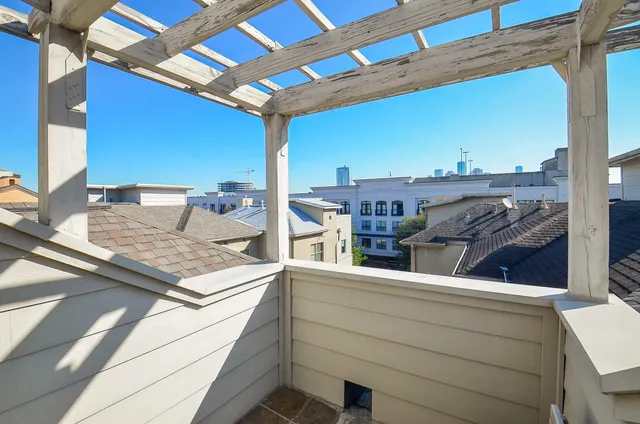 a view of a balcony with two chairs