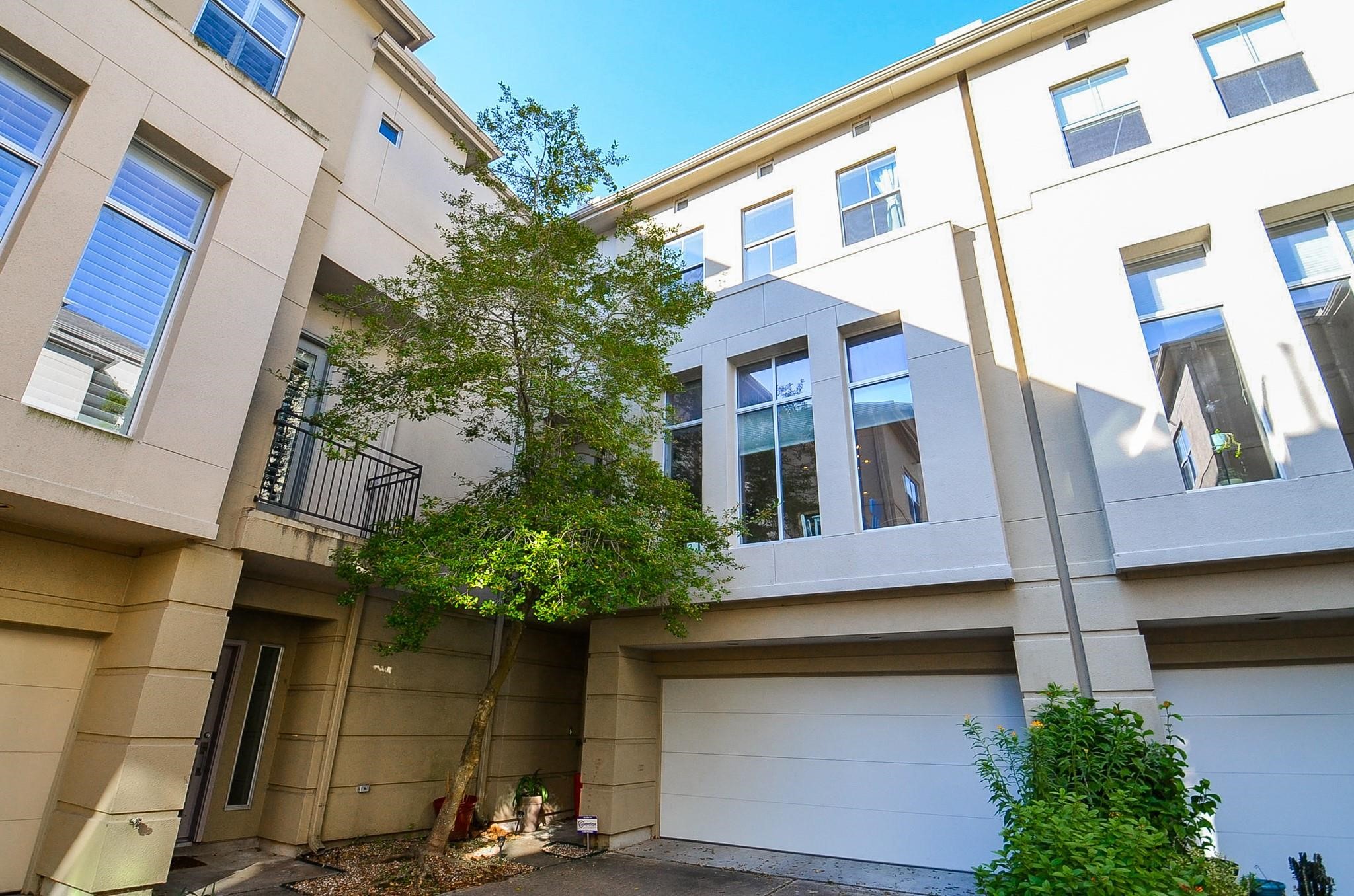 1116 Columbus Street Houston, TX 77019 - Photo 32 of 32 a front view of a multi story residential apartment building