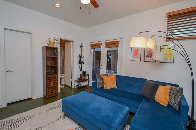 a living room with furniture and rug