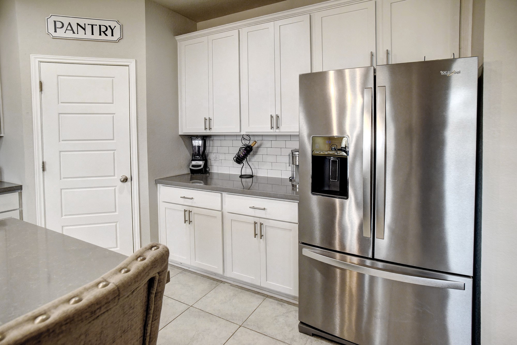 210 Cold Spg Loop, Unit 1 Bastrop, TX 78602 - Photo 14 of 40 a kitchen with stainless steel appliances granite countertop a refrigerator and a sink
