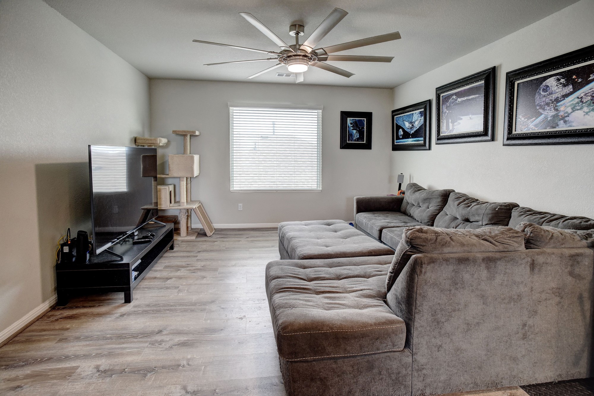 210 Cold Spg Loop, Unit 1 Bastrop, TX 78602 - Photo 23 of 40 a living room with furniture ceiling fan and a window