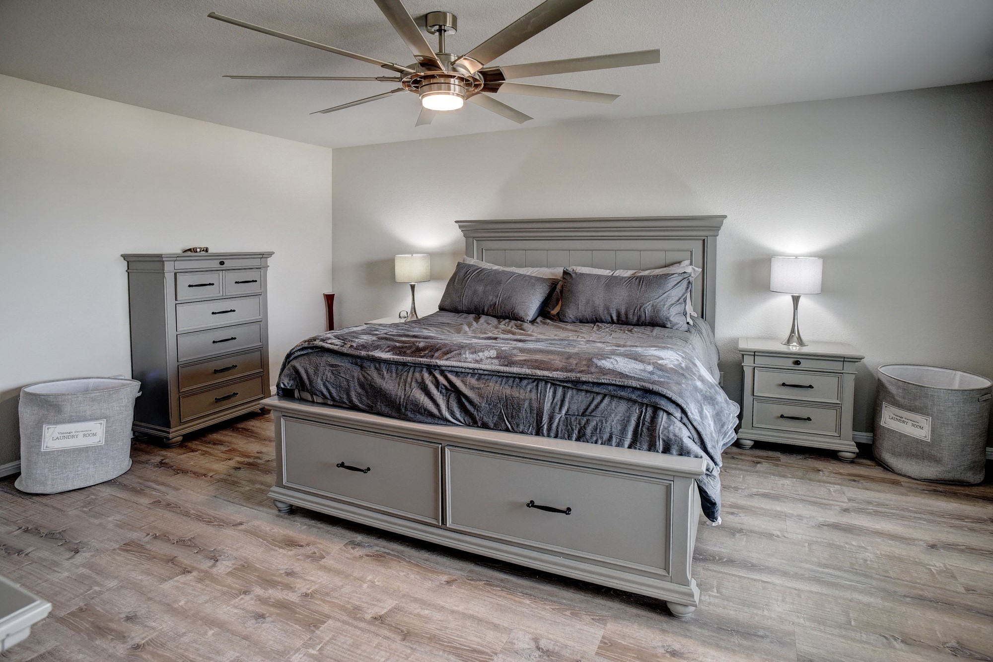 210 Cold Spg Loop, Unit 1 Bastrop, TX 78602 - Photo 26 of 40 a bedroom with a bed and a chandelier
