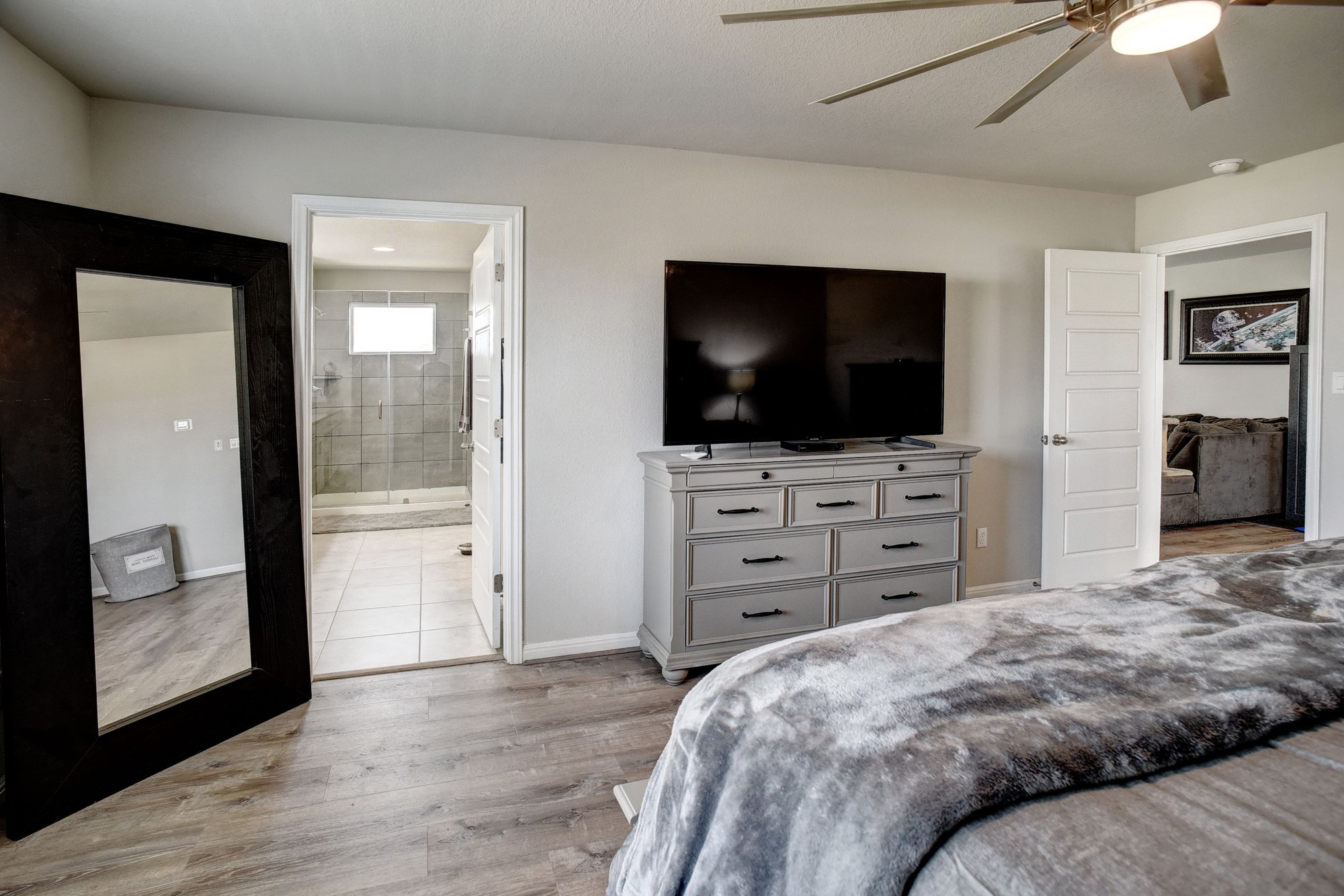 210 Cold Spg Loop, Unit 1 Bastrop, TX 78602 - Photo 28 of 40 a bedroom with a bed and furniture