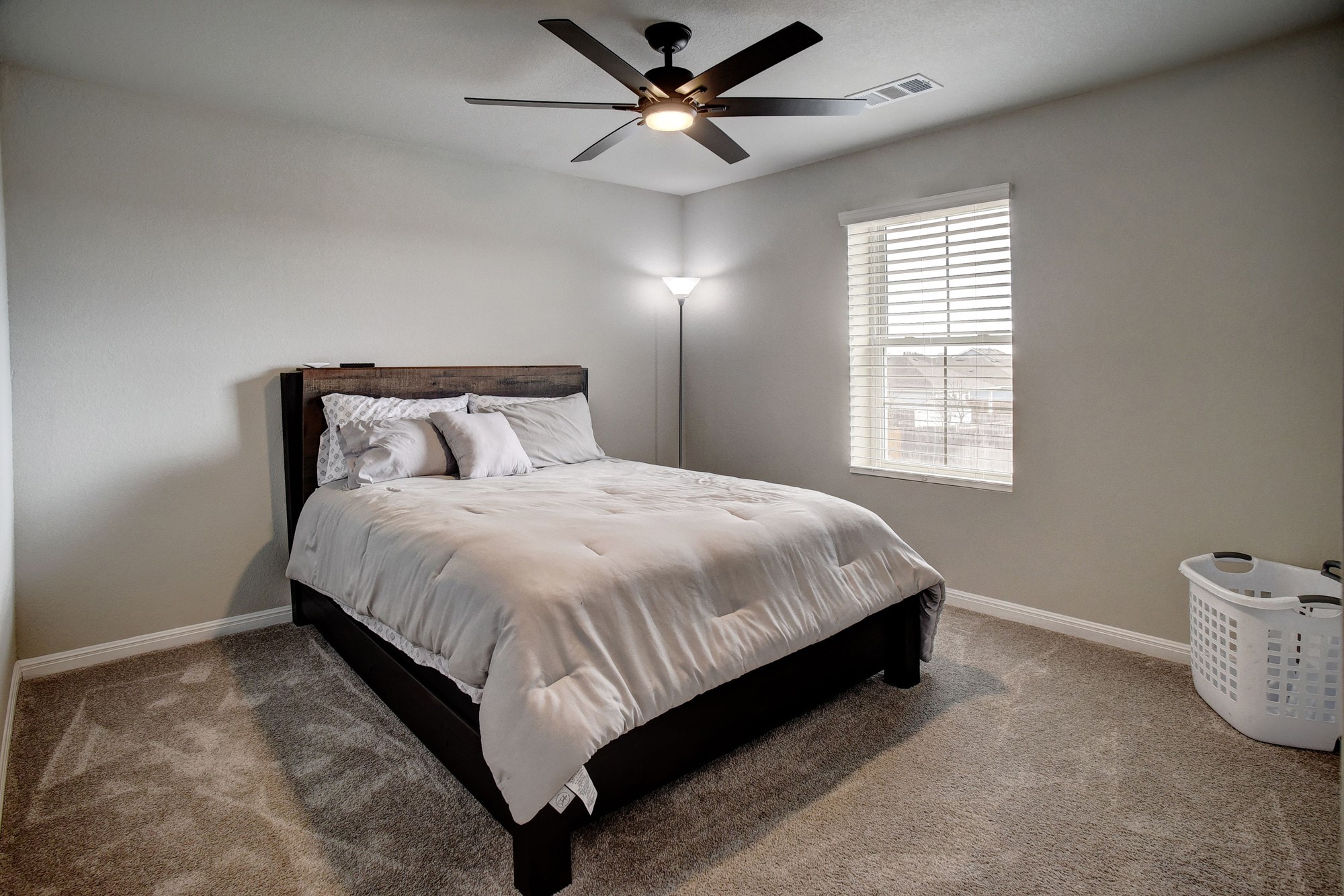 210 Cold Spg Loop, Unit 1 Bastrop, TX 78602 - Photo 31 of 40 a large bed sitting in a bedroom next to a window