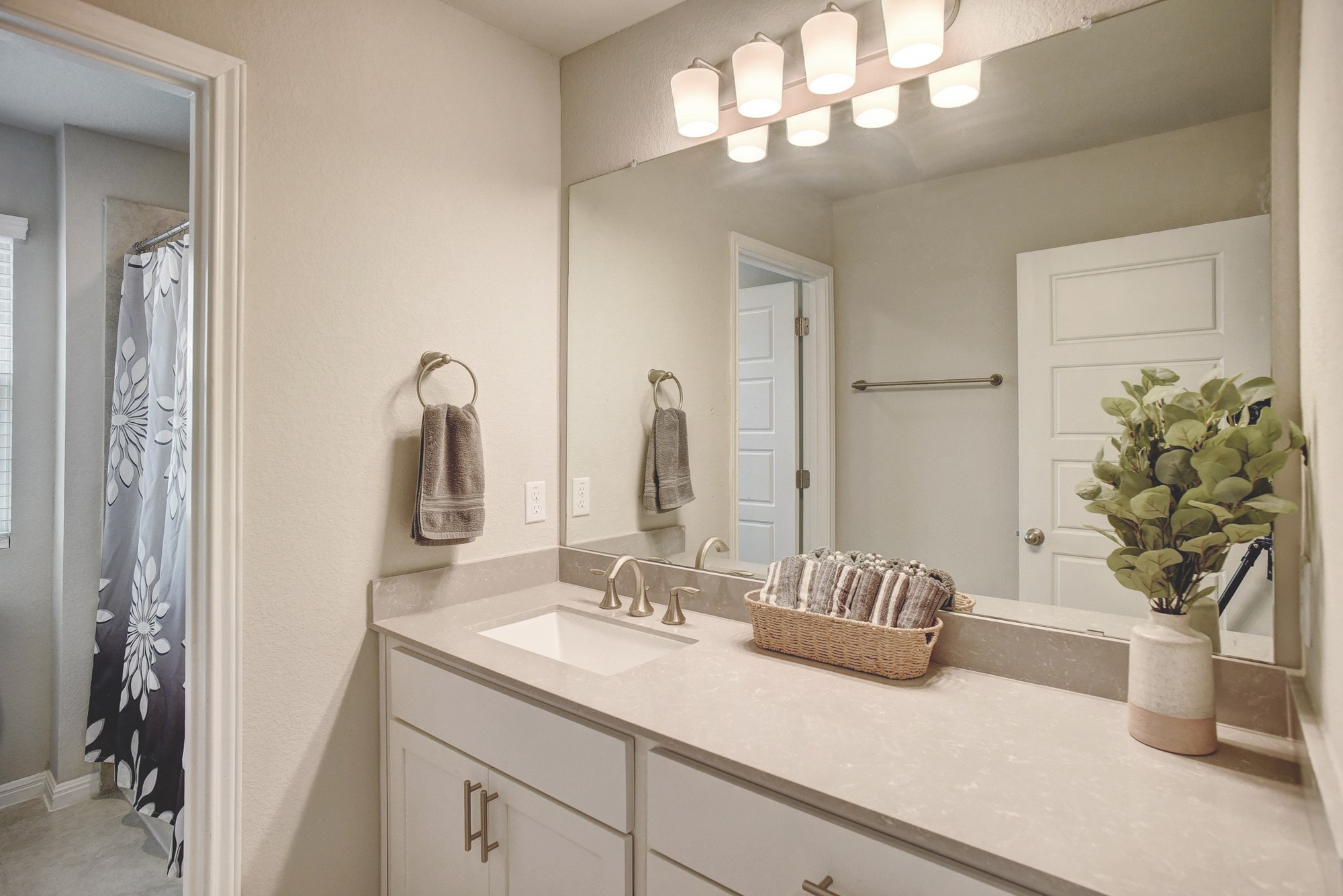 210 Cold Spg Loop, Unit 1 Bastrop, TX 78602 - Photo 35 of 40 a bathroom with a sink a toilet and a mirror