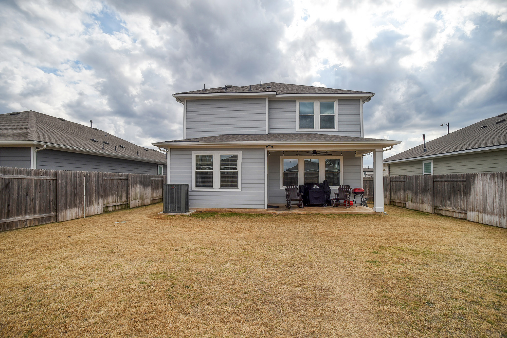 210 Cold Spg Loop, Unit 1 Bastrop, TX 78602 - Photo 38 of 40 a view of a house with a yard and covered with snow
