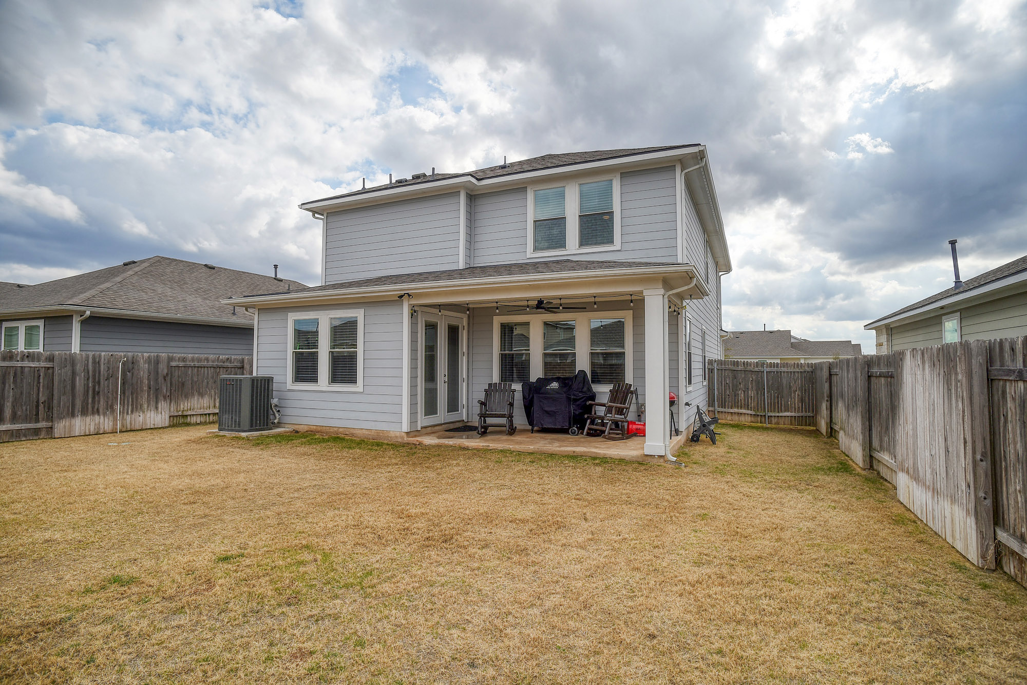 210 Cold Spg Loop, Unit 1 Bastrop, TX 78602 - Photo 39 of 40 a view of a house with a yard and sitting area