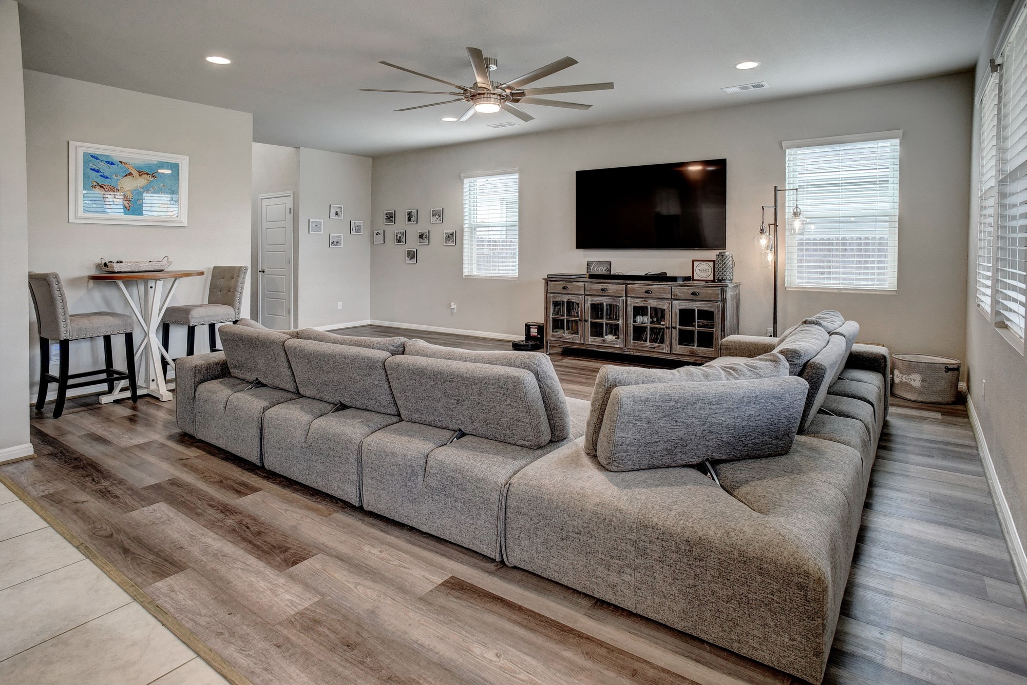 210 Cold Spg Loop, Unit 1 Bastrop, TX 78602 - Photo 7 of 40 a living room with furniture and a flat screen tv