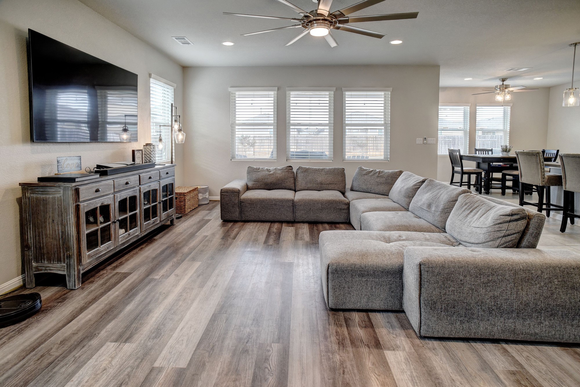 210 Cold Spg Loop, Unit 1 Bastrop, TX 78602 - Photo 9 of 40 a living room with furniture and a wooden floor
