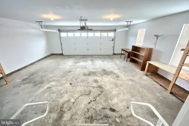 a view of a room with furniture and windows