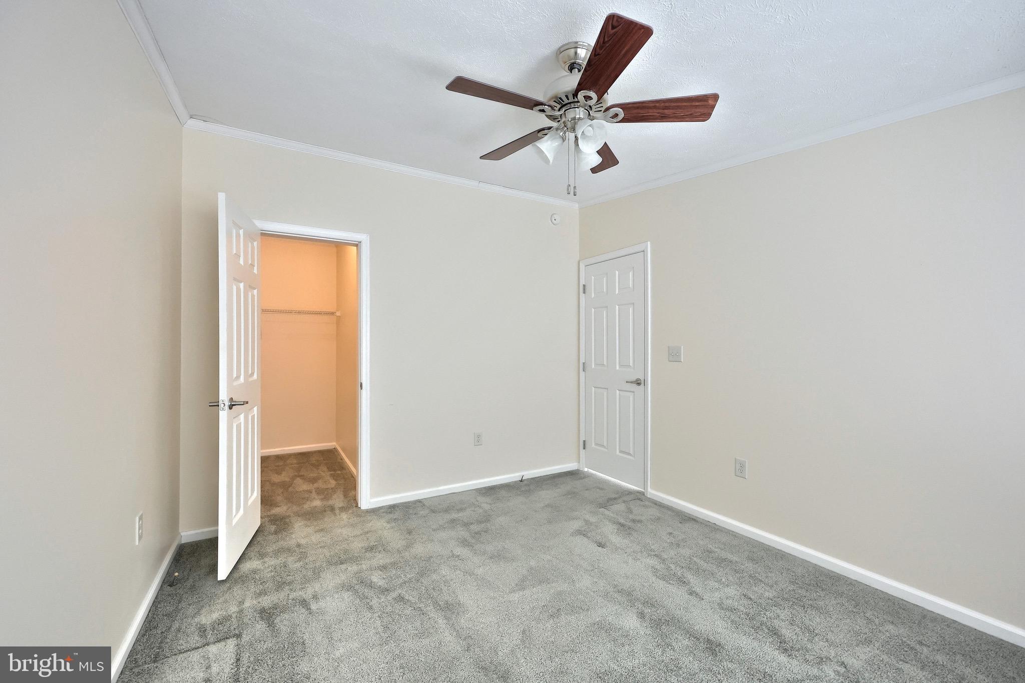 267 Runaway Road Abbottstown, PA 17301 - Photo 21 of 38 an empty room with a ceiling fan and carpet