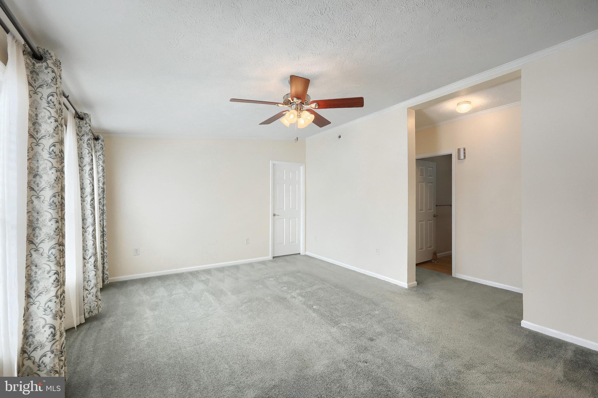 267 Runaway Road Abbottstown, PA 17301 - Photo 8 of 38 a view of a livingroom with a ceiling fan and window