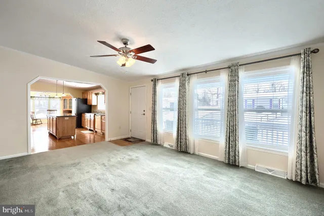 a kitchen with counter top space and wooden floor