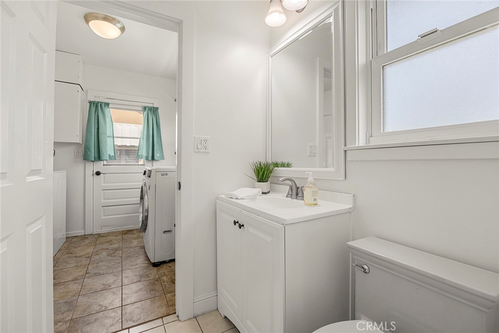 907 Chestnut Avenue Brea, CA 92821 - Photo 15 of 35 a bathroom with a sink a toilet and a mirror