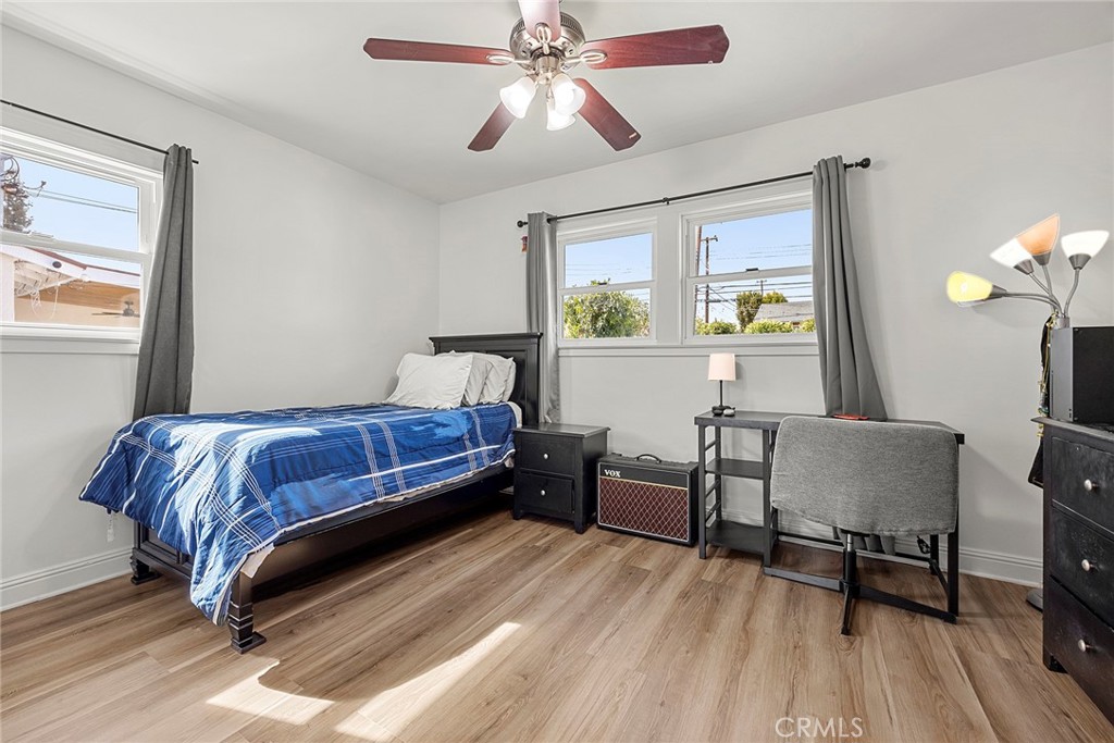 907 Chestnut Avenue Brea, CA 92821 - Photo 18 of 35 a bedroom with a bed lamps and window