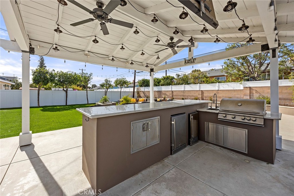 907 Chestnut Avenue Brea, CA 92821 - Photo 26 of 35 a kitchen with a sink stove and cabinets