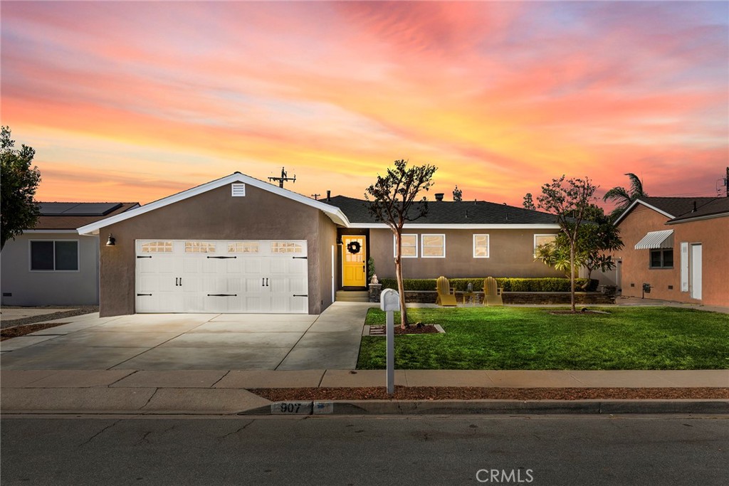907 Chestnut Avenue Brea, CA 92821 - Photo 34 of 35 a front view of a house with a yard and garage