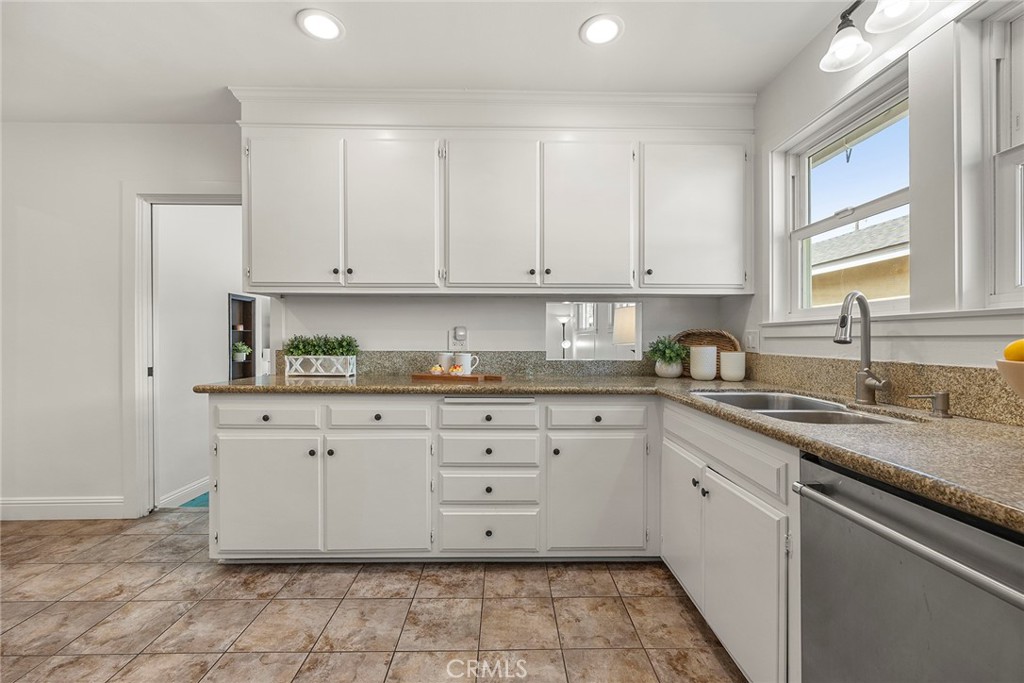 907 Chestnut Avenue Brea, CA 92821 - Photo 5 of 35 a kitchen with stainless steel appliances granite countertop a sink stove and cabinets