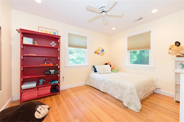 10 Briggs Road Lexington, MA 02421 - Photo 20 of 30 a bedroom with a bed and a window
