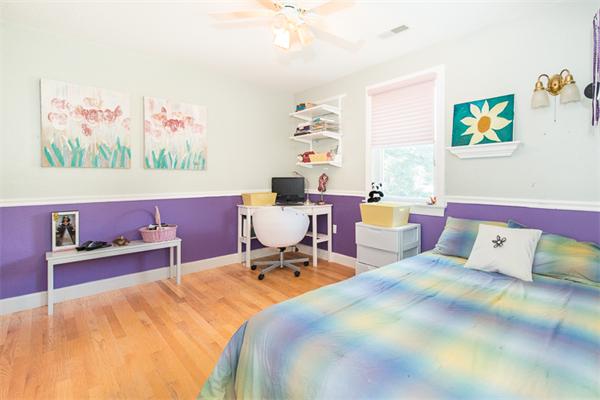 10 Briggs Road Lexington, MA 02421 - Photo 22 of 30 a bed room with a bed and a chair