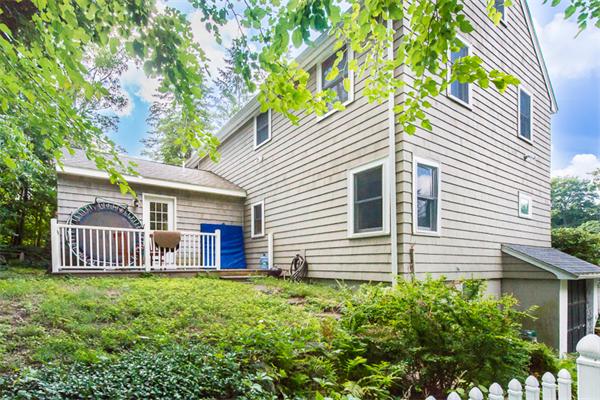 10 Briggs Road Lexington, MA 02421 - Photo 29 of 30 a view of a house with a backyard and a tree