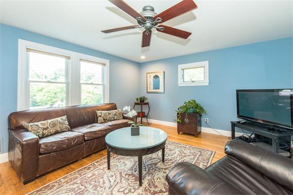 10 Briggs Road Lexington, MA 02421 - Photo 6 of 30 a living room with furniture and a flat screen tv