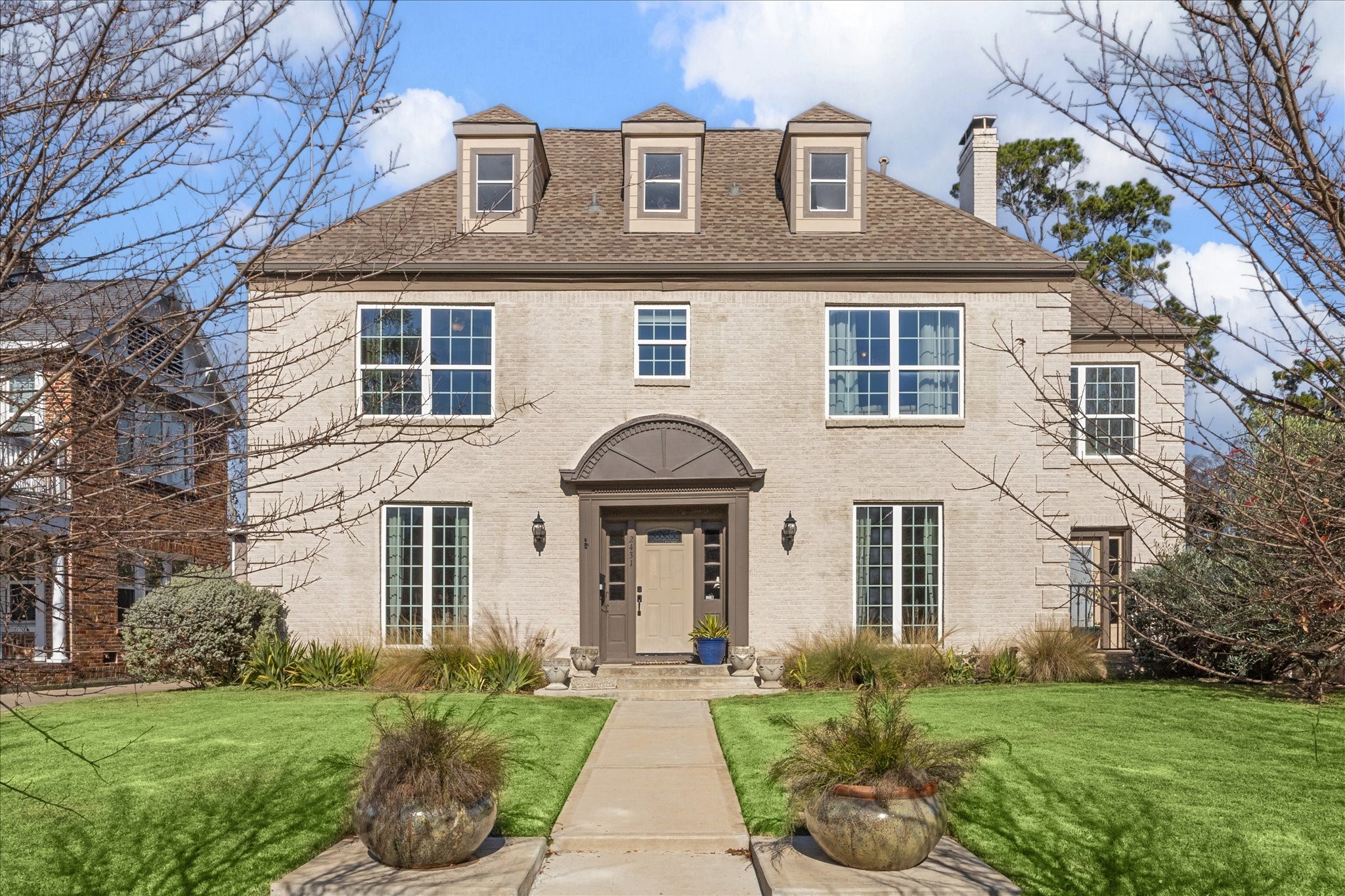 a front view of a house with garden