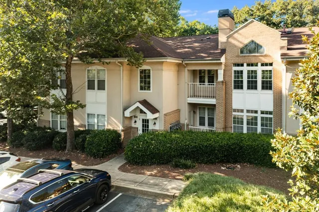 a view of multiple houses with a yard