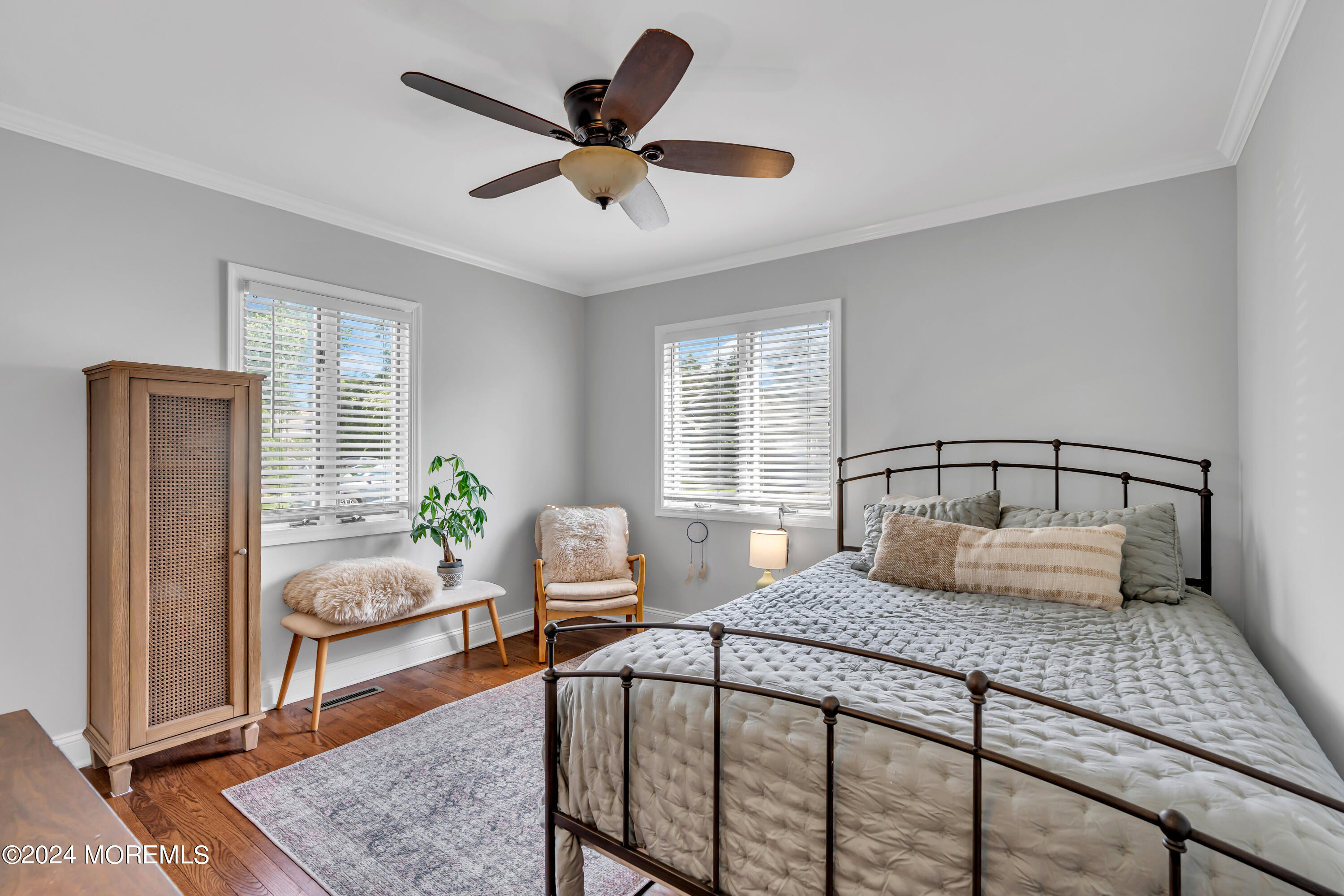 2217 Edgar Road Point Pleasant, NJ 08742 - Photo 23 of 46 a bedroom with a bed and a dresser with wooden floor