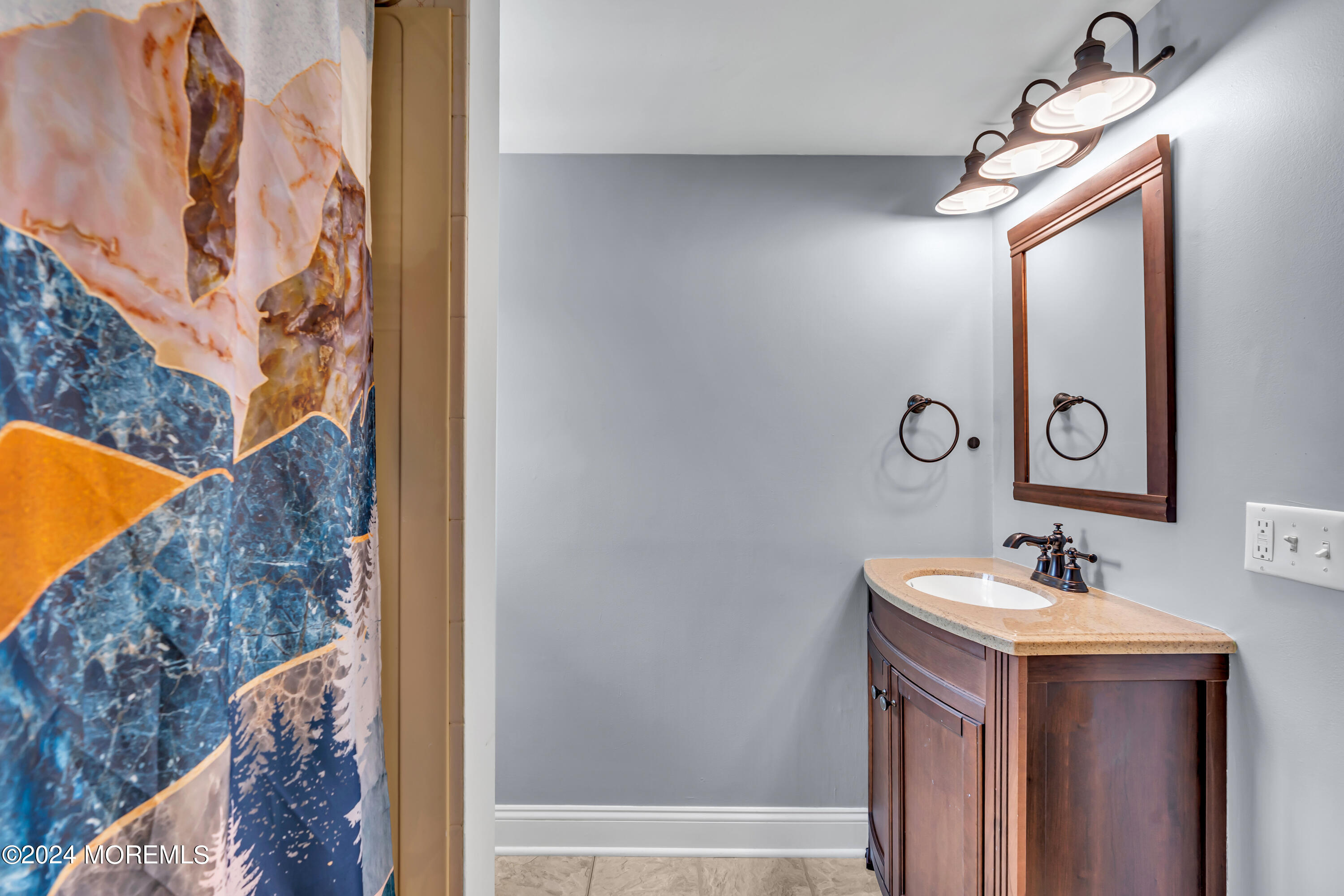 2217 Edgar Road Point Pleasant, NJ 08742 - Photo 33 of 46 a bathroom with a sink and a mirror