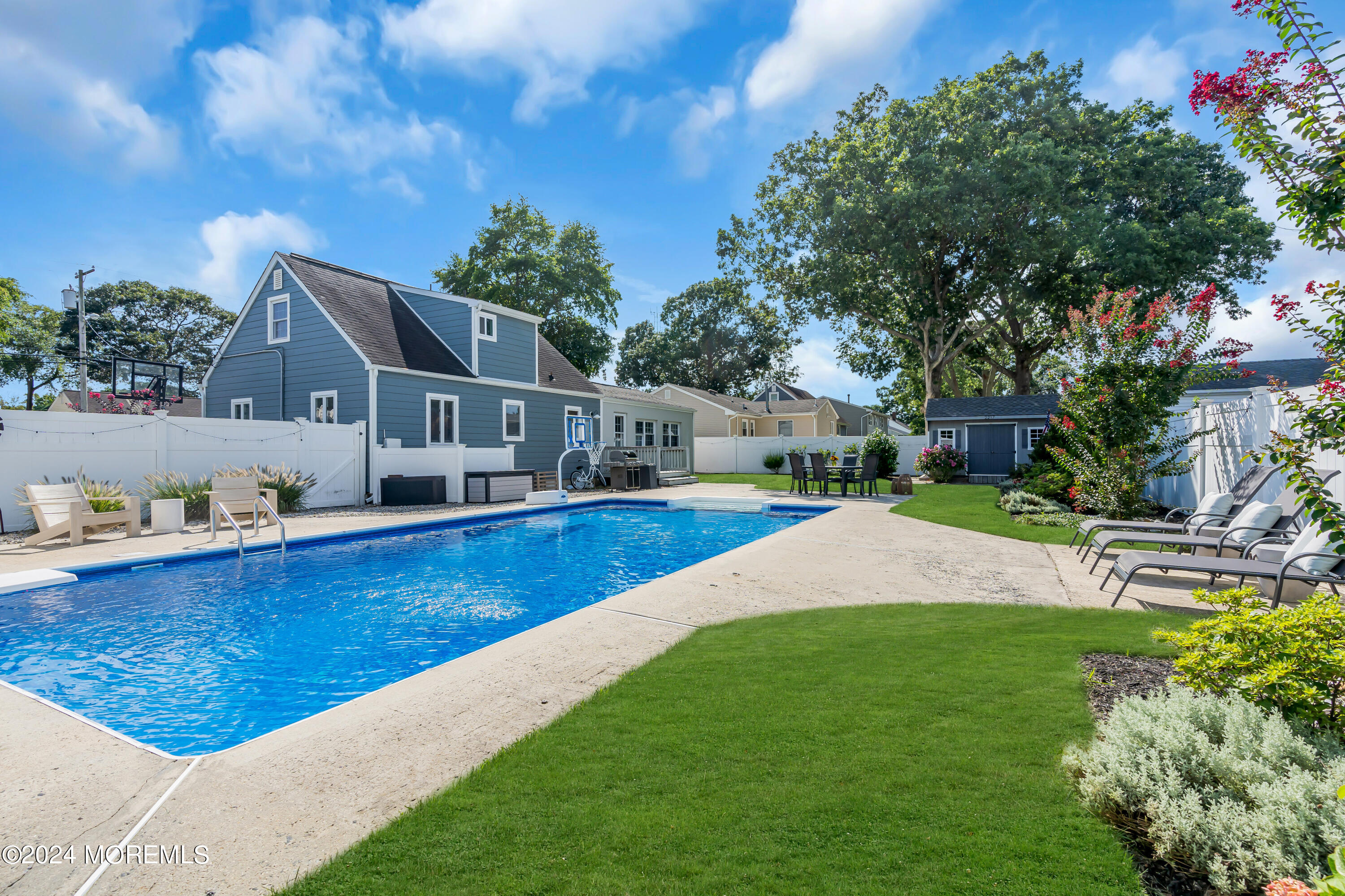 2217 Edgar Road Point Pleasant, NJ 08742 - Photo 36 of 46 a view of house with swimming pool yard and outdoor seating