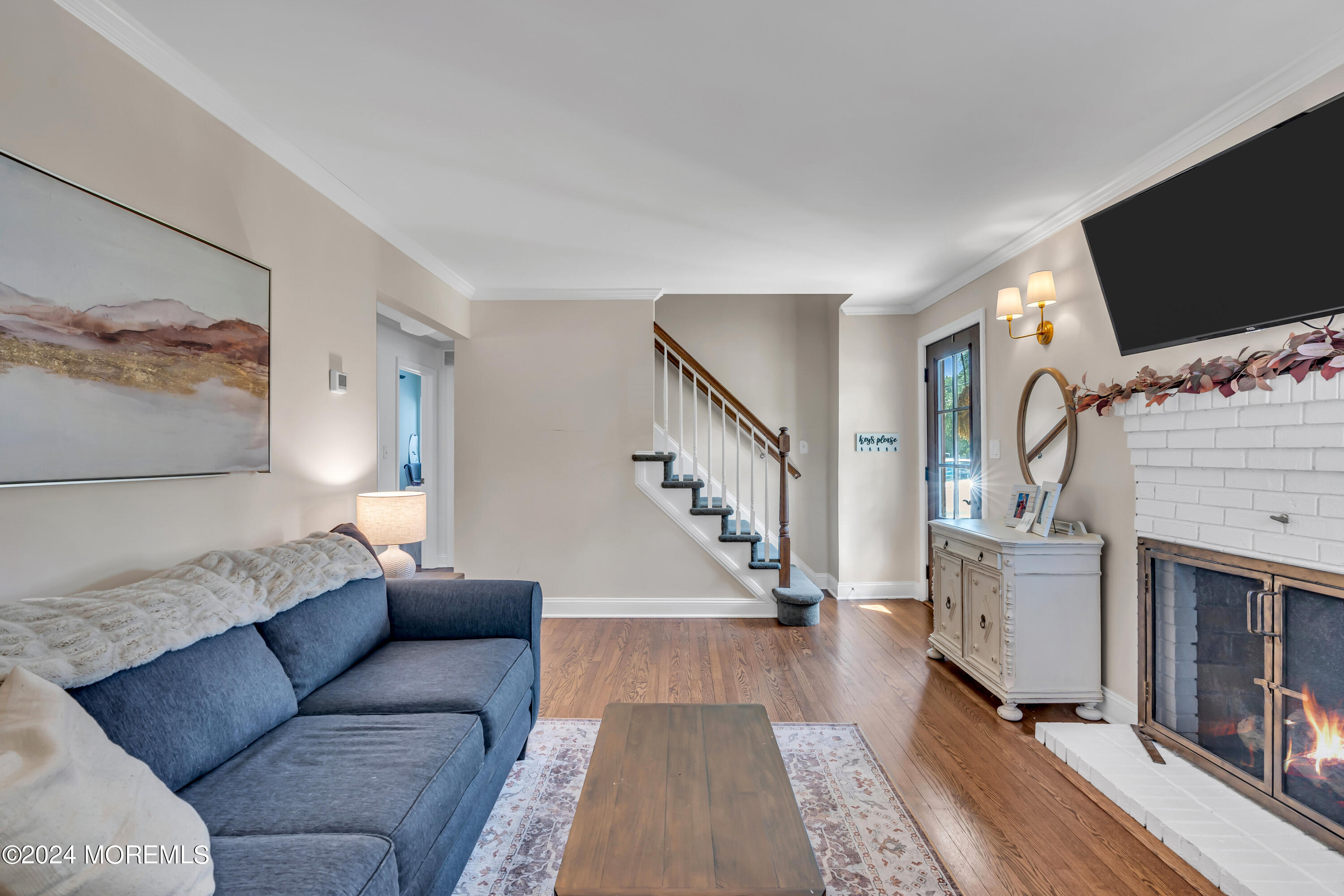 2217 Edgar Road Point Pleasant, NJ 08742 - Photo 6 of 46 a living room with furniture and a flat screen tv